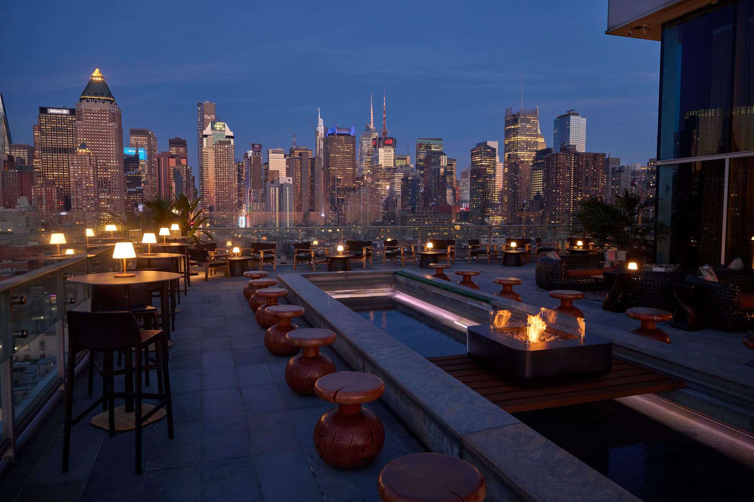 Hudson VU rooftop at dusk with the Midtown skyline