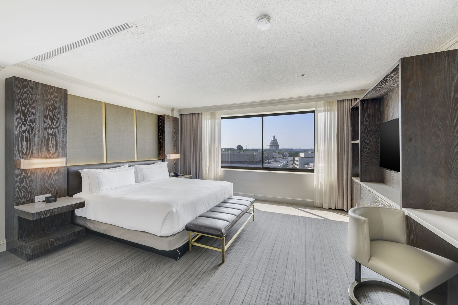 King guest room at Hilton Capitol Hill with the U.S. Capitol dome in the window